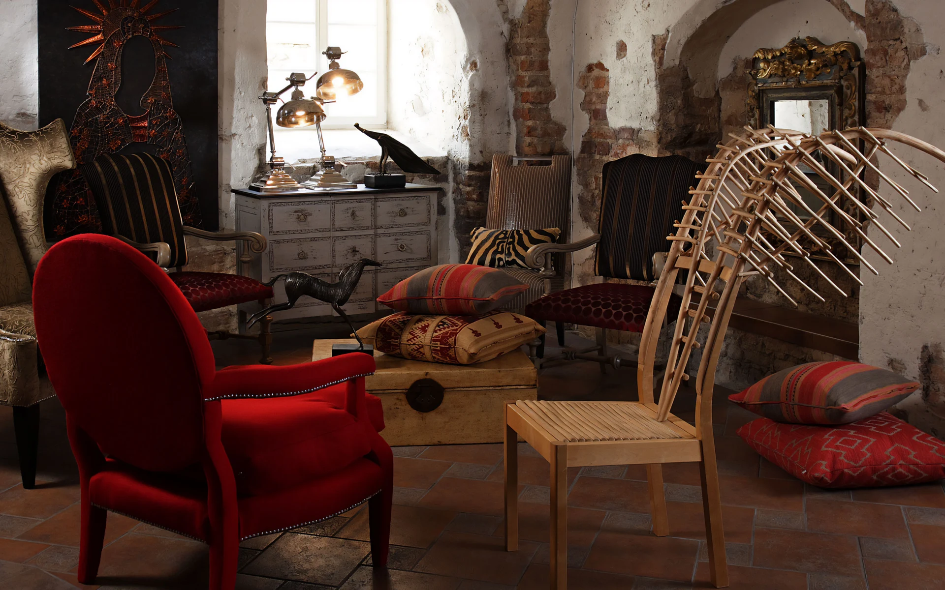 Original be saiko! interior gallery with art, sculptural furniture, and dining chairs